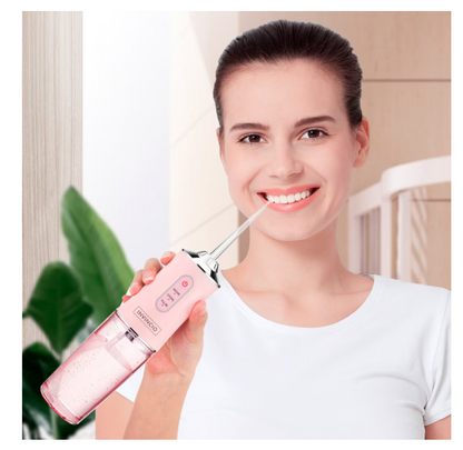 Irigator oral Portabil PPS Pulse pentru dus bucal,  Capete Curatare Anti-Tartru, Rezervor 200 ml, Roz Pastel, verde si alb